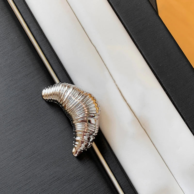The Croissant Pin: Your Tiny Luxury Touch