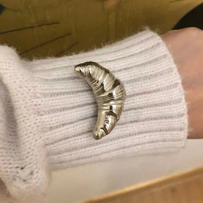 The Croissant Pin: Your Tiny Luxury Touch