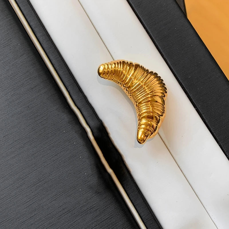 The Croissant Pin: Your Tiny Luxury Touch